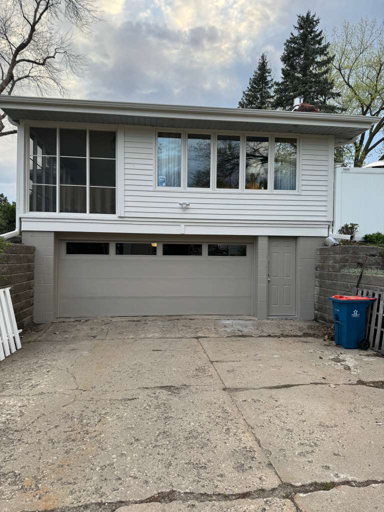 White and gray home after exterior painting